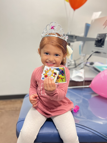 Caring for Dental Crowns Happy Greenville Patient with Prizes